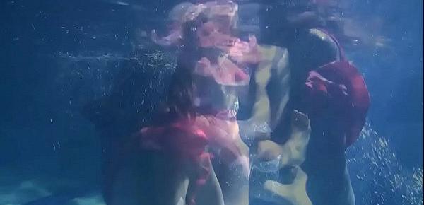  Two hot lesbians underwater touching each-other. Young girls schoolgirls are naked in the pool. Young nudists ..